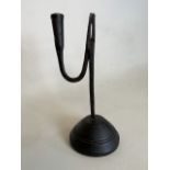 An English rush light holder C.1800. With wrought iron arm on a turned dome base. H:25cm