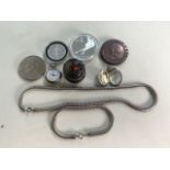 £5 coin, a Canadian 20 dollar coin and two other also with a silvered snake necklace and