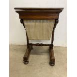 A small mahogany sewing table with lift up lid to storage also with pull out sewing basket. With