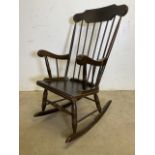 A hardwood Eastern European rocking chair.W:56cm x D:60cm x H:105cm