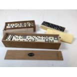 Three boxed sets of dominos: a 55 piece Galalith set, a 28:piece set made in USSR and an Ebony and