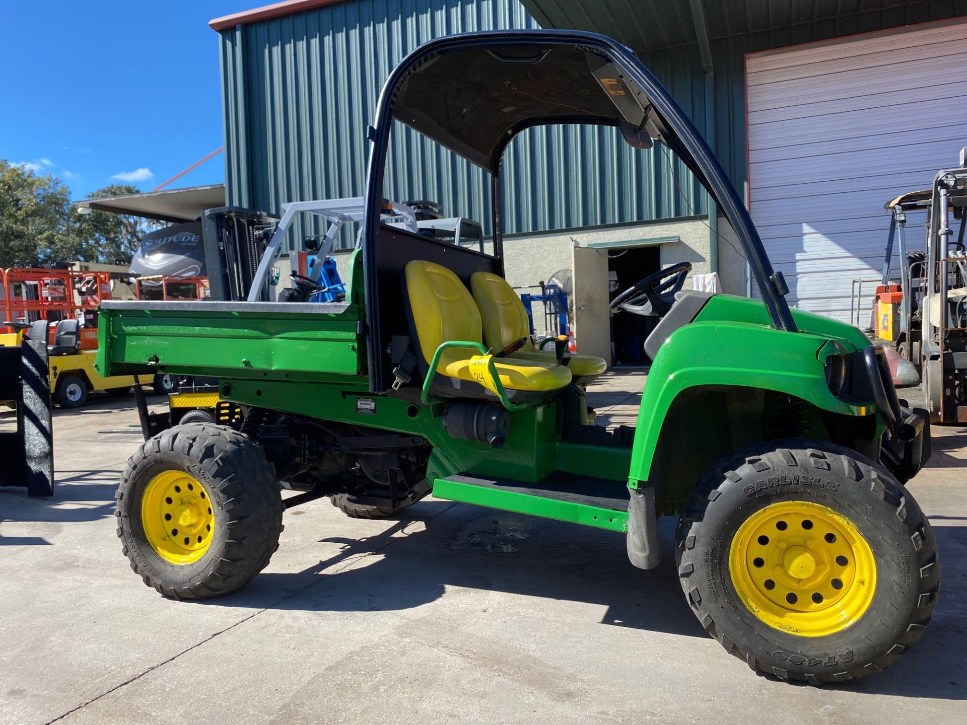 JOHN DEERE GATOR XUV ATV WITH DUMP BED, GAS POWERED, 1,713 HOURS SHOWING, RUNS AND DRIVES