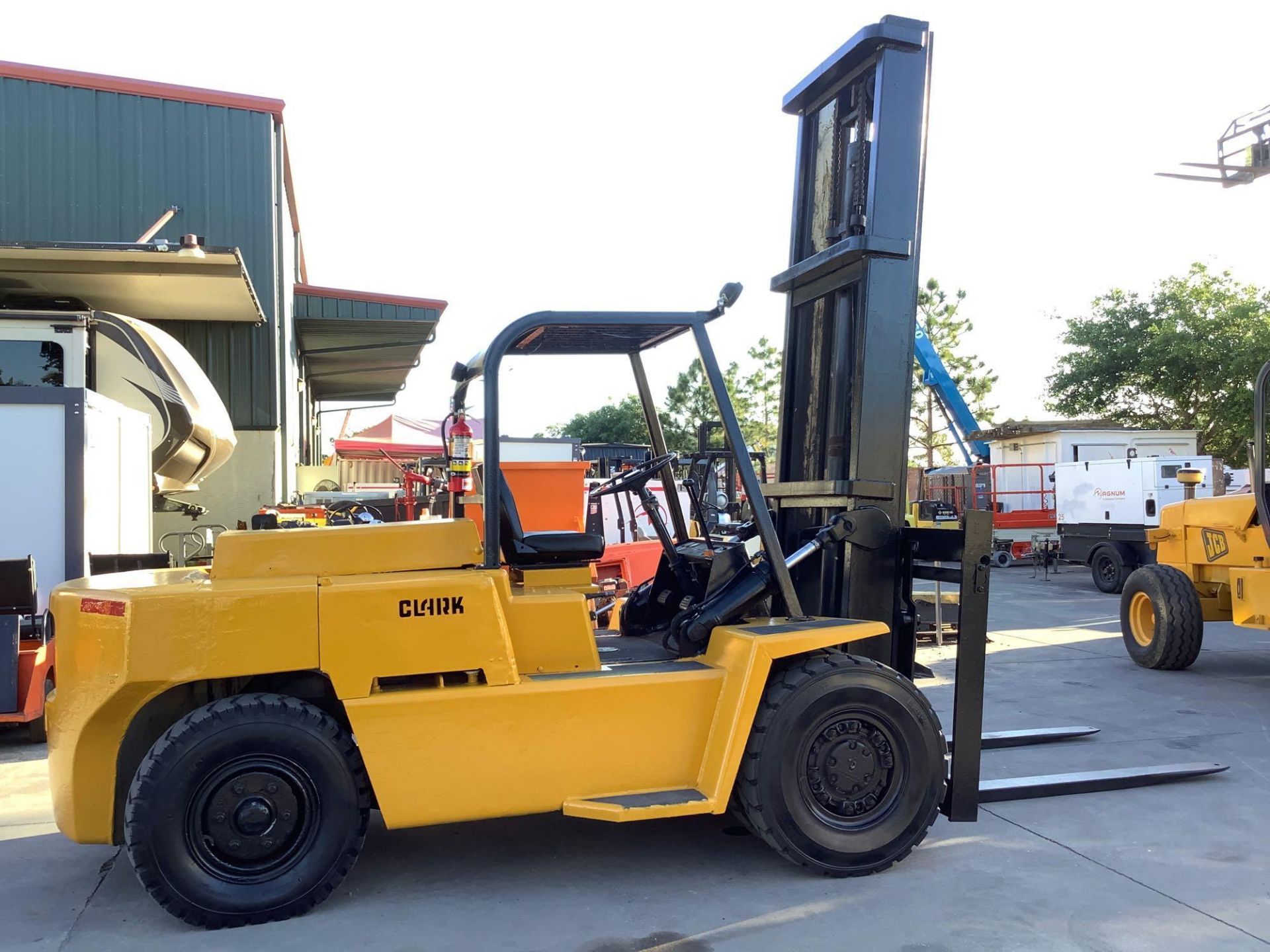 CLARK FORKLIFT ,GAS POWERED, APPROX 70IN FORKS, APPROX. WEIGHT CAPACITY 12,000 LBS - 15,000LBS