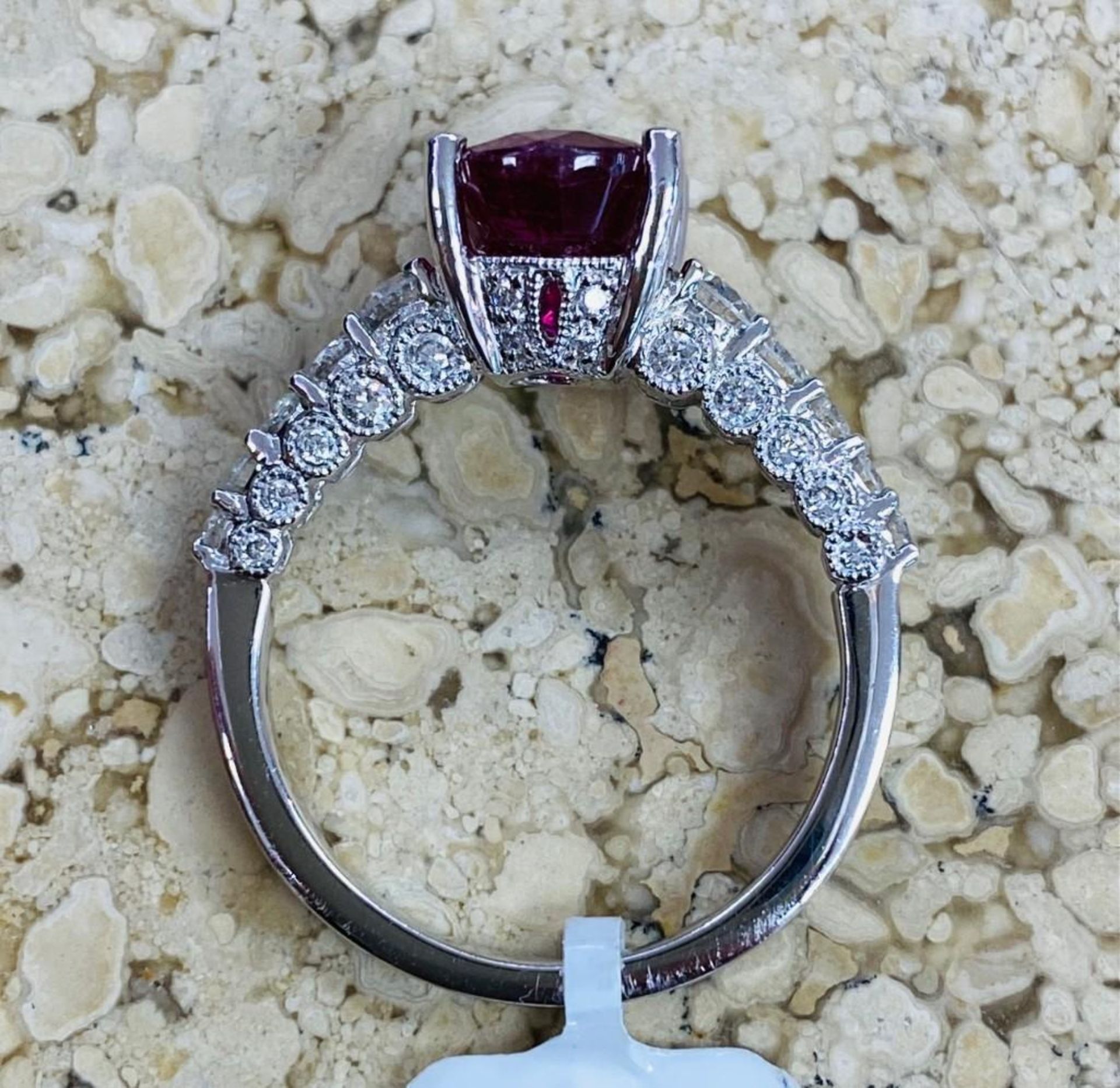 CLARITY ENHANCED RUBY AND DIAMOND RING. APPROXIMATELY 3.20CT RUBY. APPROXIMATELY .63CT NIC - Image 3 of 3