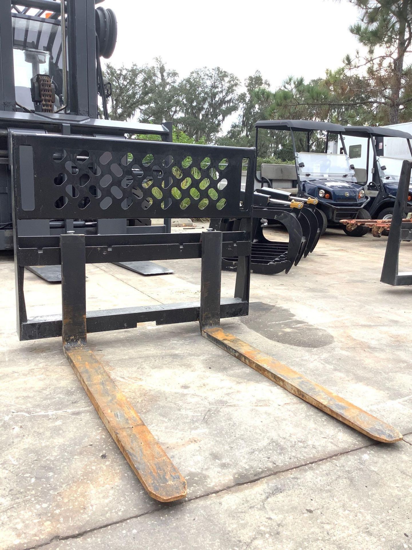 UNUSED UNIVERSAL SKID STEER ATTACHMENT, APPROX 45" WIDTH , APPROX 48'' FORKS