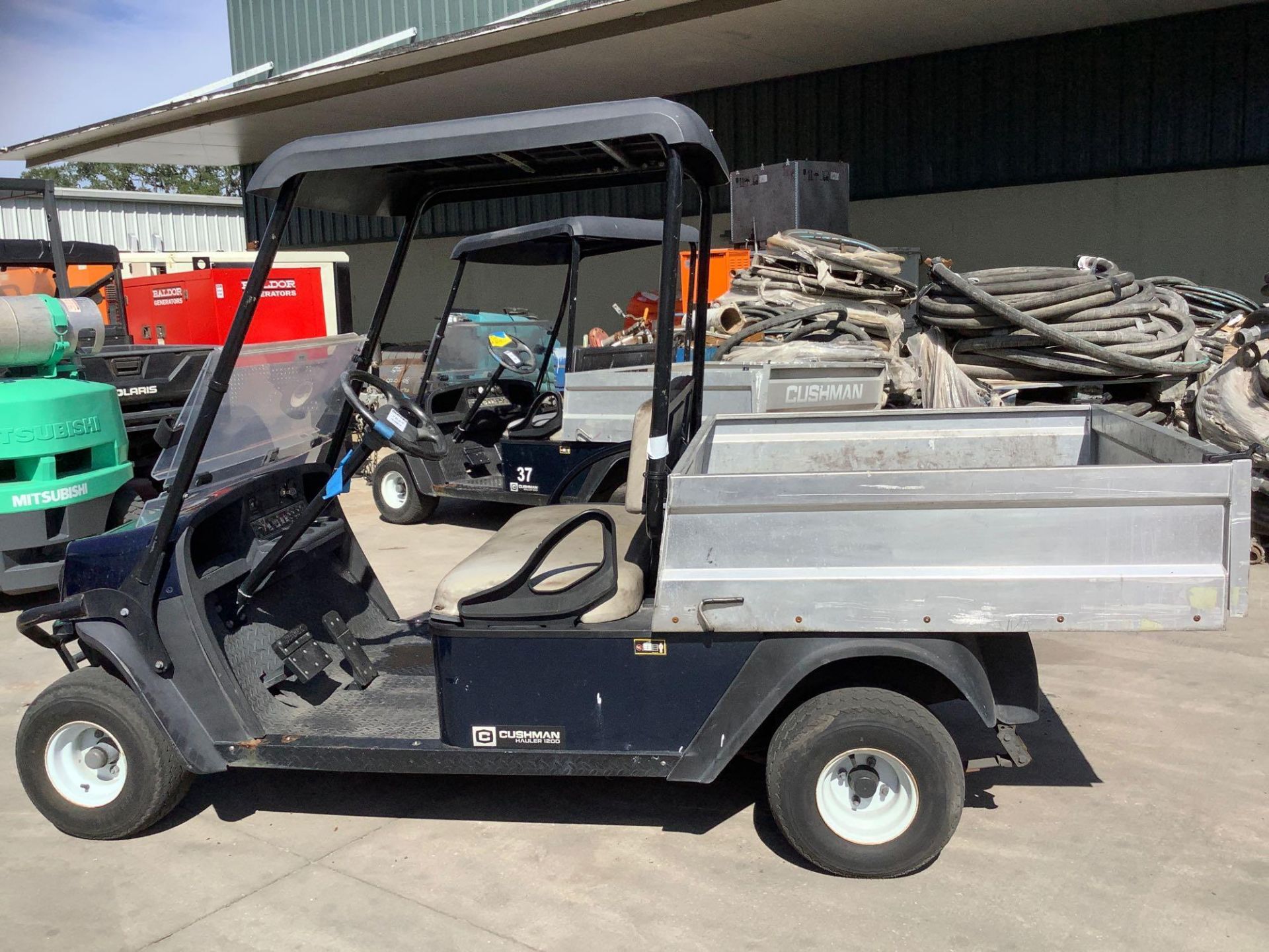 2016 CUSHMAN TEXTRON GOLF CART MODEL CSH HAUL 1200 G, GAS POWERED, KAWASAKI ENGINE, MANUAL DUMP BED, - Image 7 of 11