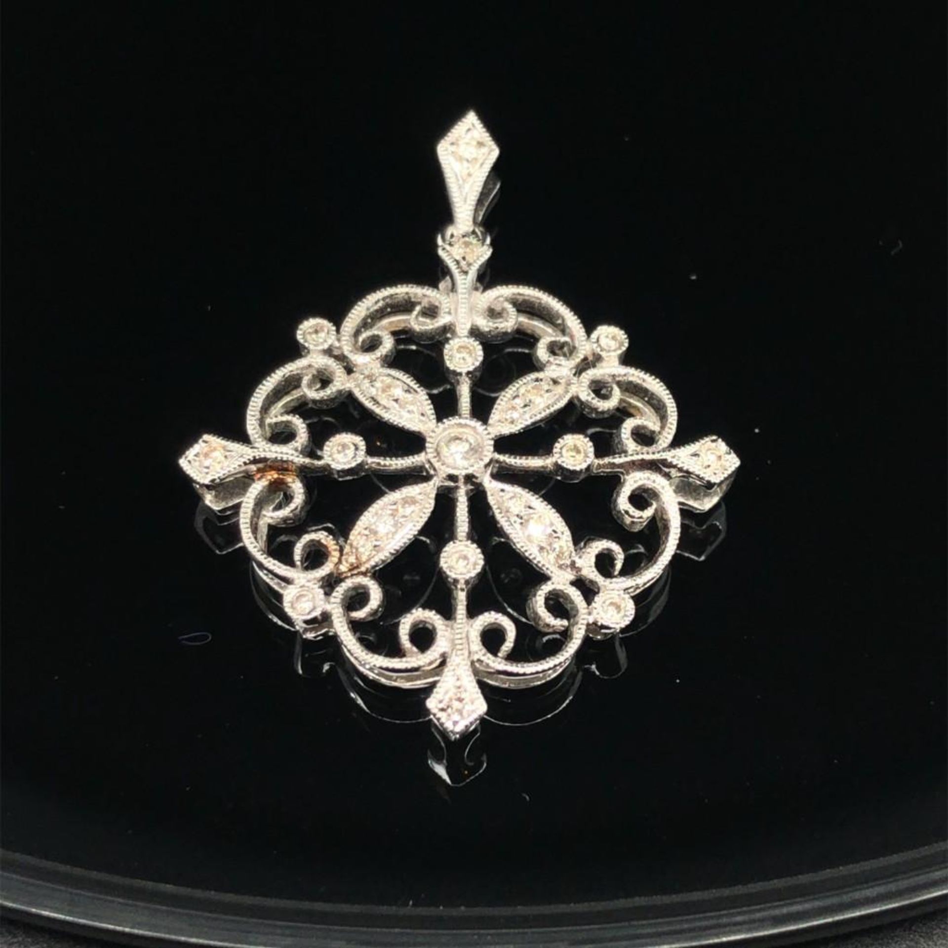 ESTATE DIAMOND SNOWFLAKE PENDANT. 14K WHITE GOLD. APPROXIMATELY .30CT DIAMONDS. WEIGHS APPROXIMATEL