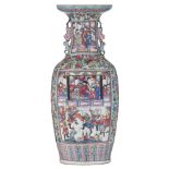 A Chinese famille rose vase, decorated with fruits, flowers and birds, the panels with a scene from