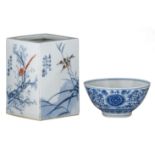 A Chinese blue and white 'lotus scroll' bowl, with a Kangxi mark. Added a Chinese polychrome brushpo