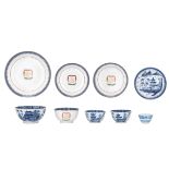 Nine Chinese blue and white export porcelain bowls, cups and saucers, some items enamelled with a mo