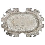 A whimsically shaped silver geometric floral decorated charger, probablyÿfictional Mexican hallmarks