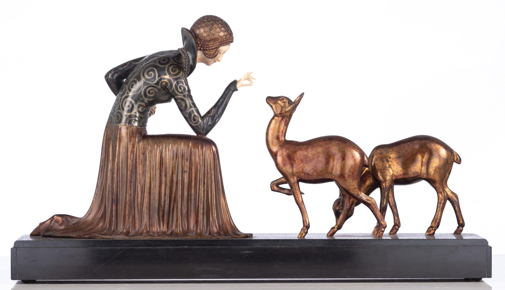 An Art Deco chryselephantine sculpture of a lady feeding deer, patinated spelter and ivory on an ony - Image 3 of 12