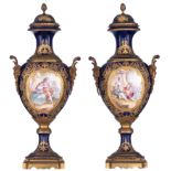 A pair of covered bleu royale ground SŠvres vases with Neoclassical gilt bronze mounts and satyr-sha