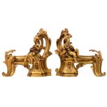 A pair of gilt bronze Napoleon III andirons, decorated with a boy and a girl playing music, H 36 cm