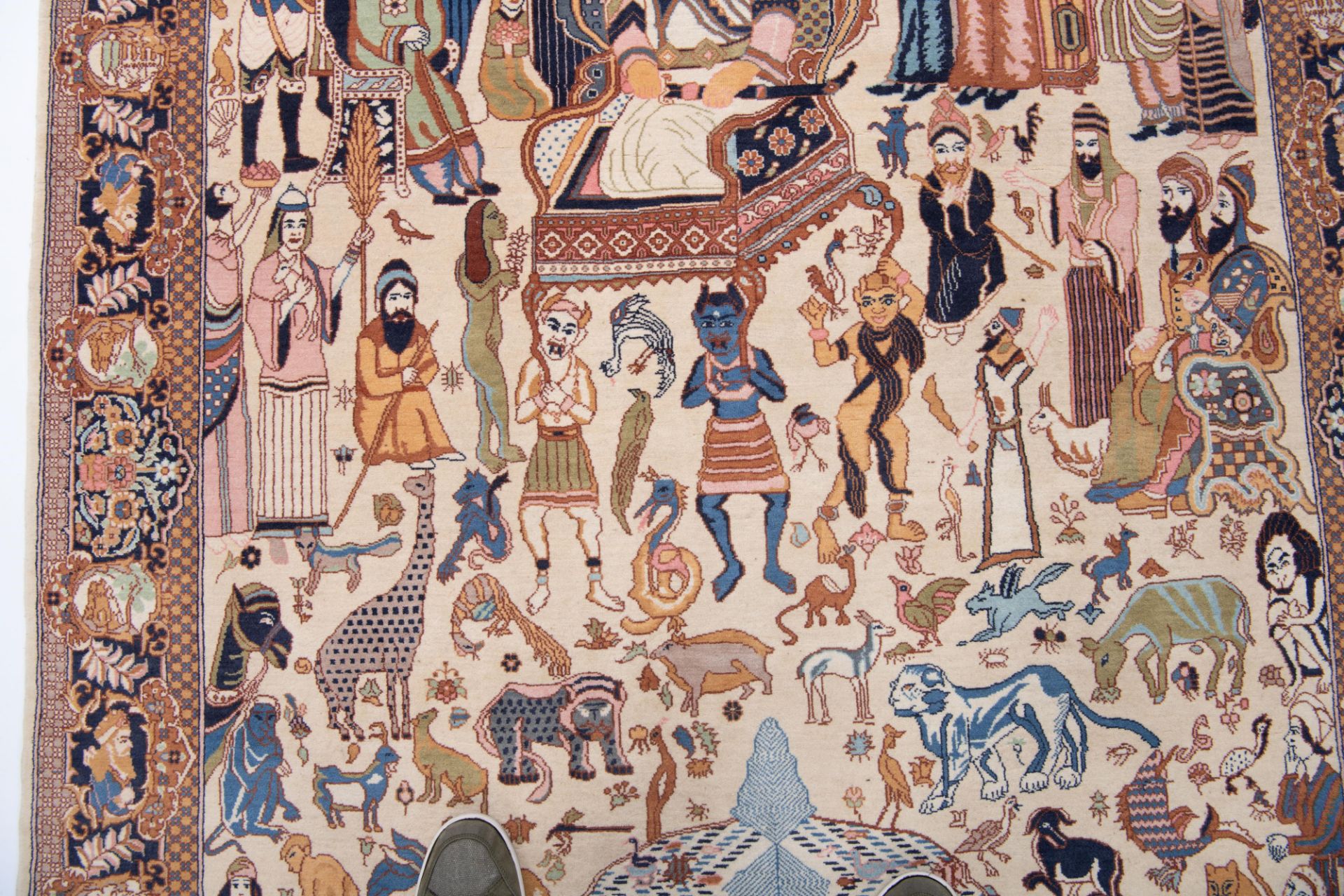 An Oriental rug depicting in the centre a procession surrounded by exotic and mythical animals, 249 - Bild 5 aus 11