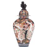 A large Japanese Imari style Samson covered vase, decorated with birds in a floral setting and a Fu