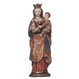 A polychrome painted walnut standing Madonna holding the Holy Child, a so-called 'Poup‚e de Malines'