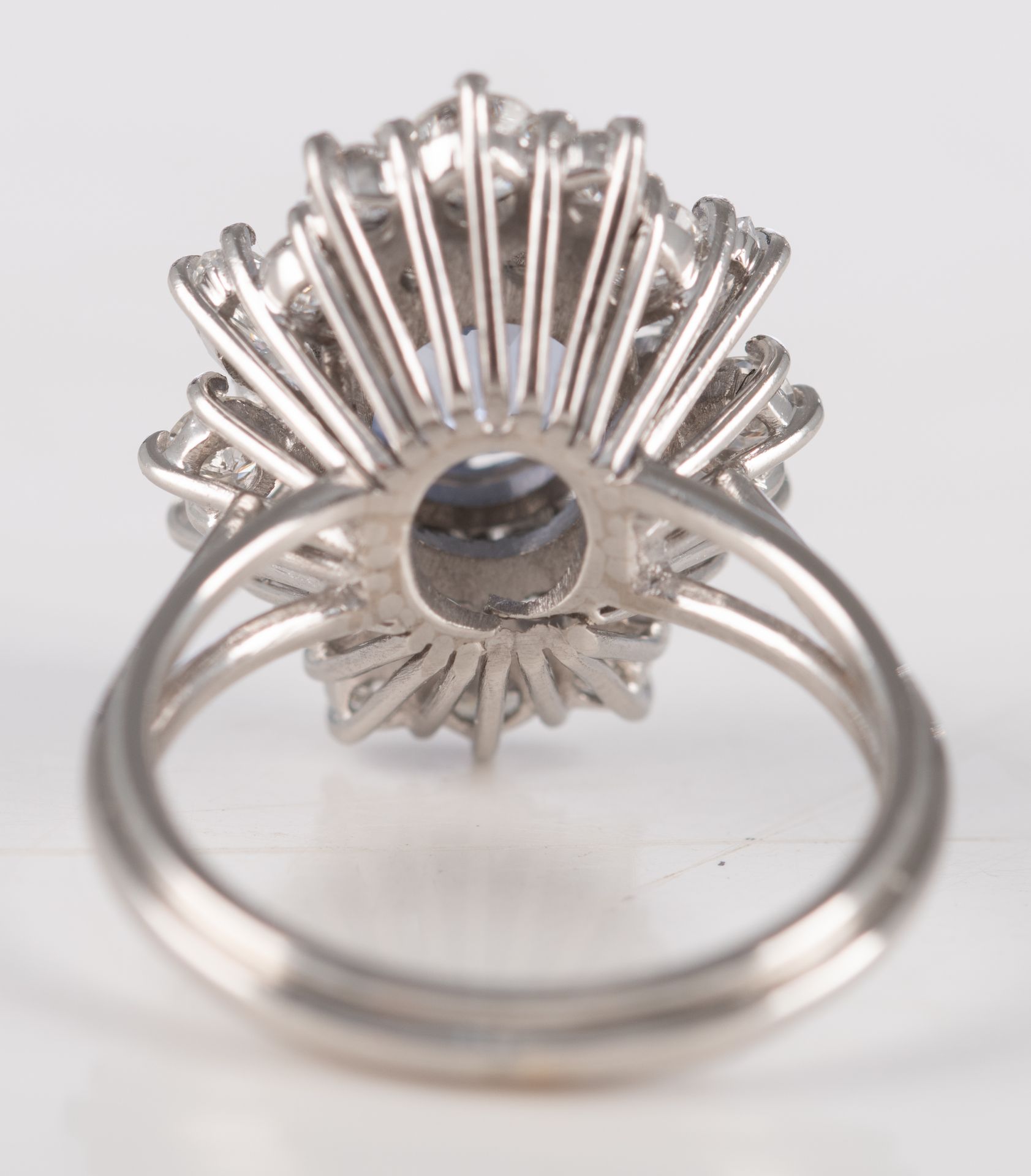 An 18ct white gold ring, central set with an oval cut sapphire and furthermore all-around mounted wi - Image 3 of 3