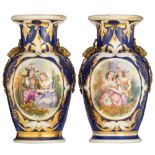 Two French blue ground porcelain vases with bronze mounts, the roundels decorated with gallant scene