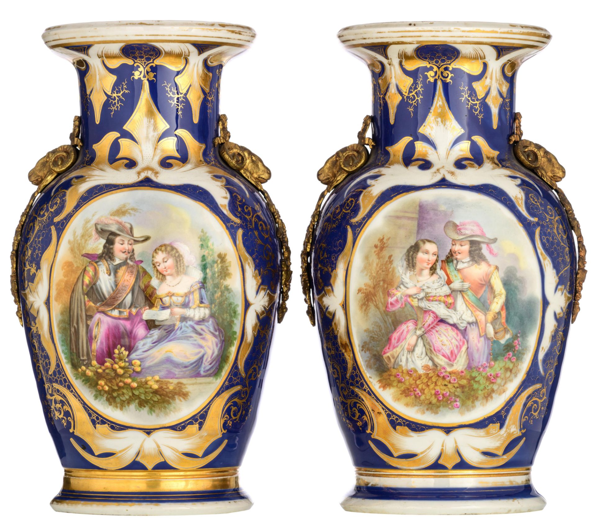 Two French blue ground porcelain vases with bronze mounts, the roundels decorated with gallant scene