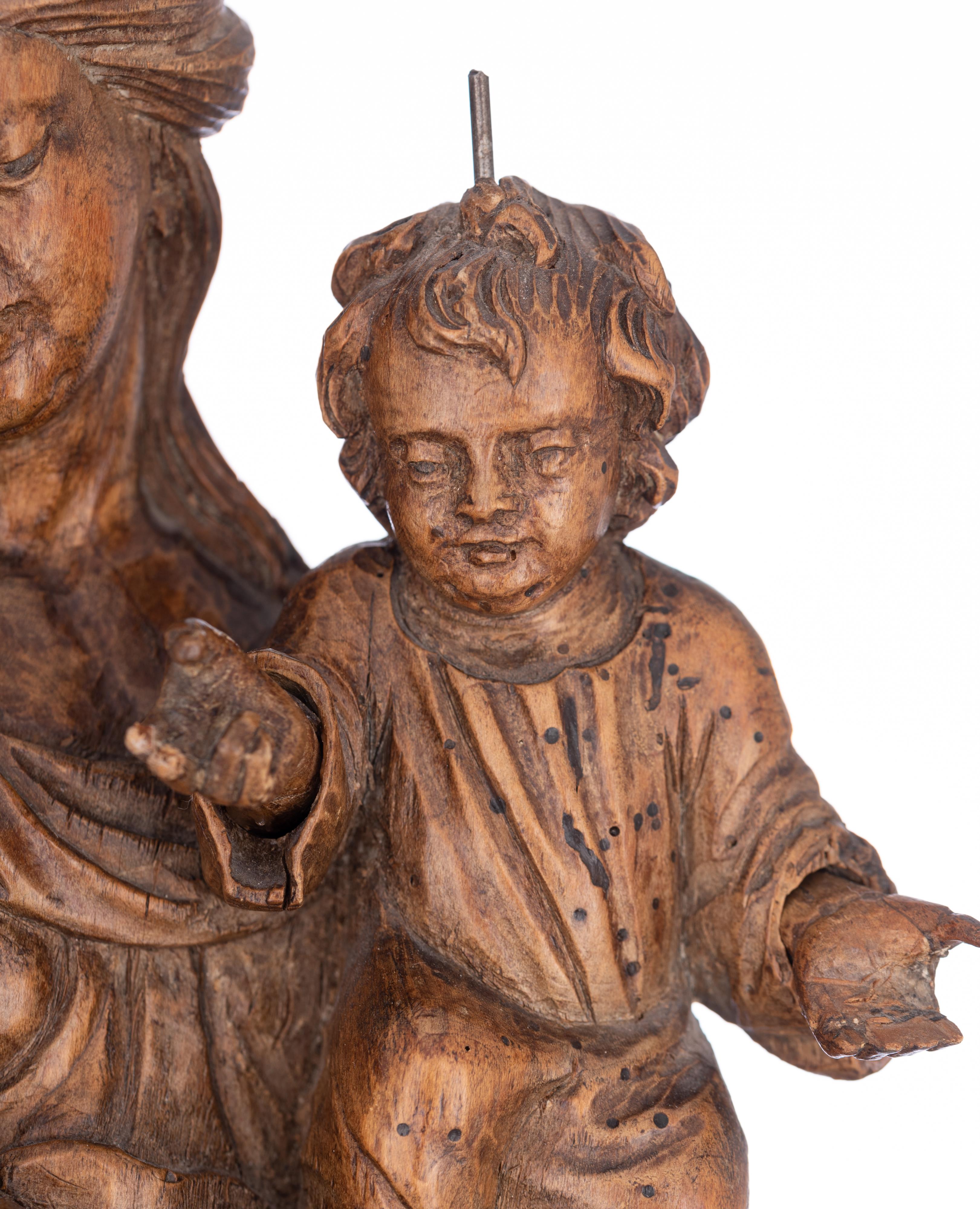 A walnut sculpture of the Madonna holding the Holy Child and standing on the crescent moon destroyin - Image 14 of 19