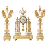 A three-piece Louis XVI-style gilt bronze and Carrara marble clock garniture, the base decorated wit