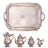 A six-piece Neoclassical silver coffee and tea set, with ivory handles, the tray monogrammed DMC, il