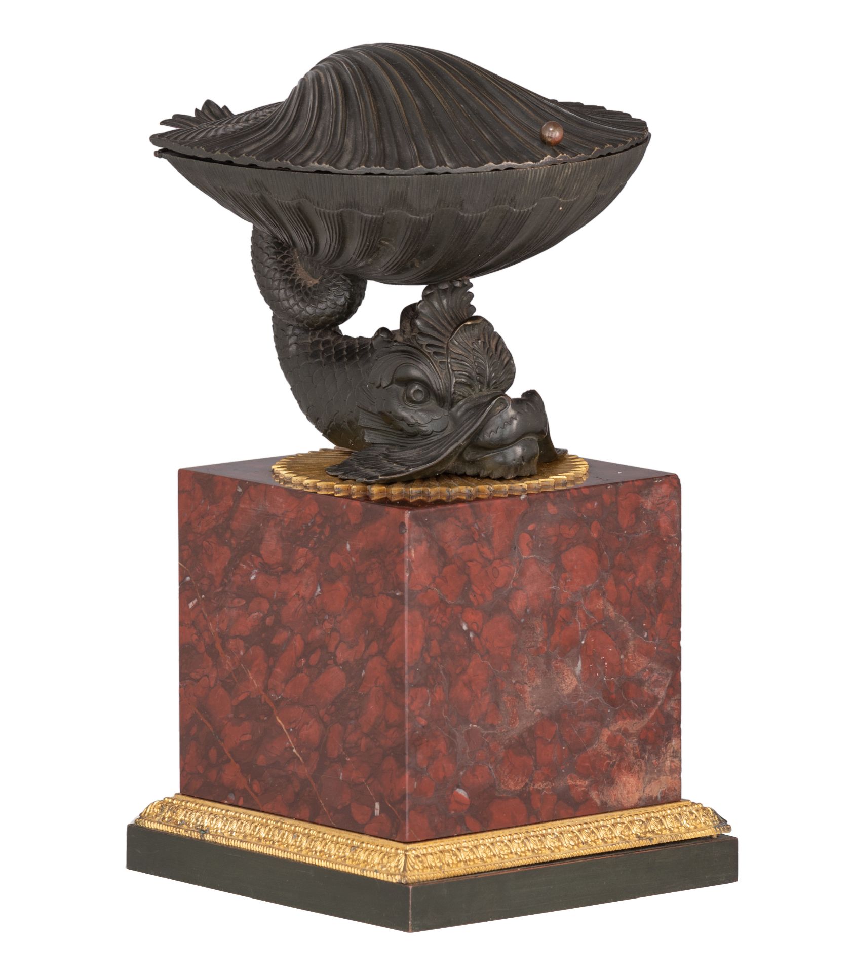 A fine French Restoration ink well, a patinated bronze dolphin holding a shell containing the writin