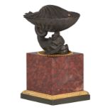 A fine French Restoration ink well, a patinated bronze dolphin holding a shell containing the writin