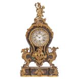 A Napoleon III Rococo Revival cartel clock, with inlaid flower decoration of brass and mother-of-pea