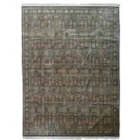 A fine Oriental rug, decorated with floral motifs, signed by the artist, 663 x 494 cm