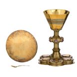 A six-lobed silver, gilt silver and partly blue enamelled Gothic Revival chalice set with cabochon-c