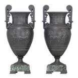 A pair of Ancient Greek style vases, decorated with palmettes and a basso-relievo frieze of a chario
