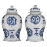 A pair of Chinese blue and white covered vases, the ogival panels decorated with a He-He boy, interc