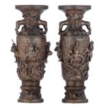 A fine pair of Chinese bronze vases, the body finely moulded with Immortals riding on mythical beast