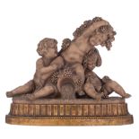 Calendi, a patinated terracotta group depicting putti playing with grapes around a source, on a gilt