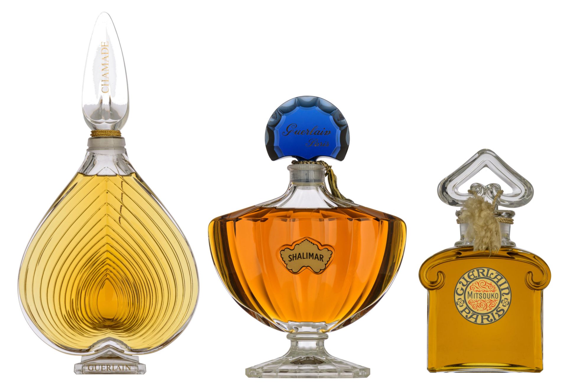 Three large perfume factice display bottles: Chamade, Shalimar and Misouko by Guerlain, H 30 - 38 -