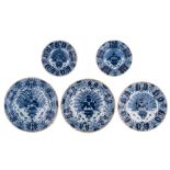 A collection of three large and two smaller blue and white 'peacock tail' decorated Dutch Delftware