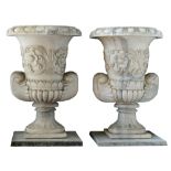 An imposing pair of Oriental-inspired white marble vases, all around decorated with basso-relievo ca