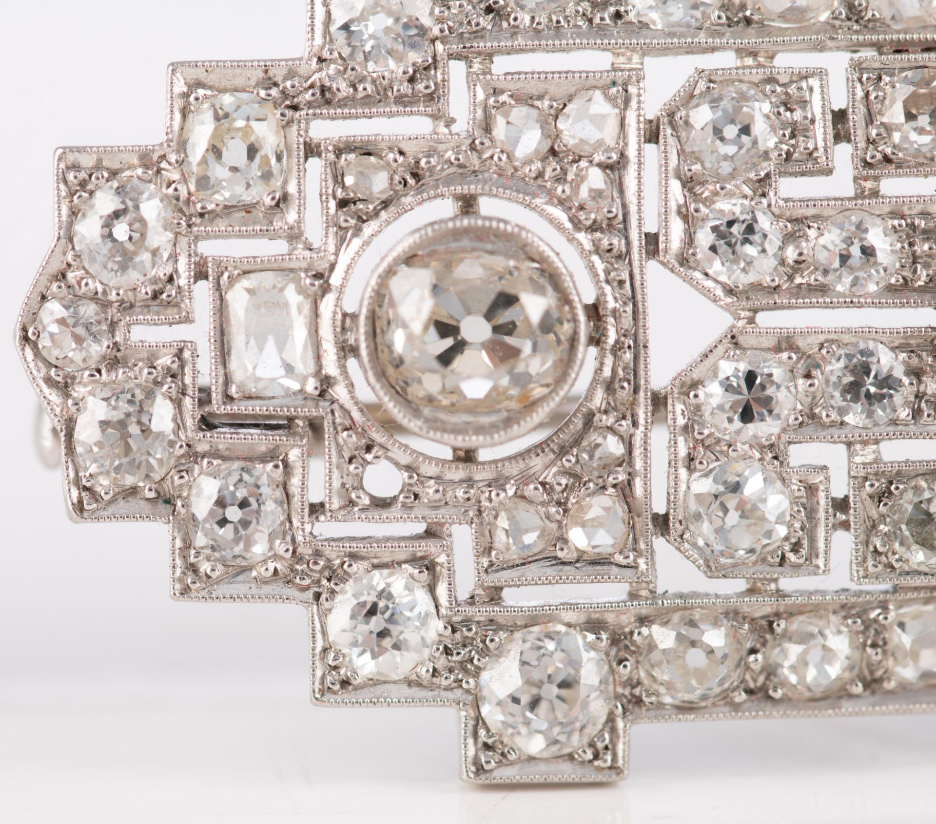 An 18ct white gold Art Deco style brooch set central with three bigger brilliant-cut diamonds and fu - Image 4 of 4