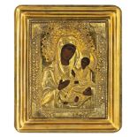 An Eastern European icon depicting the Holy Mother and Child with a gilt oklad, 17 x 21 cm (the okla