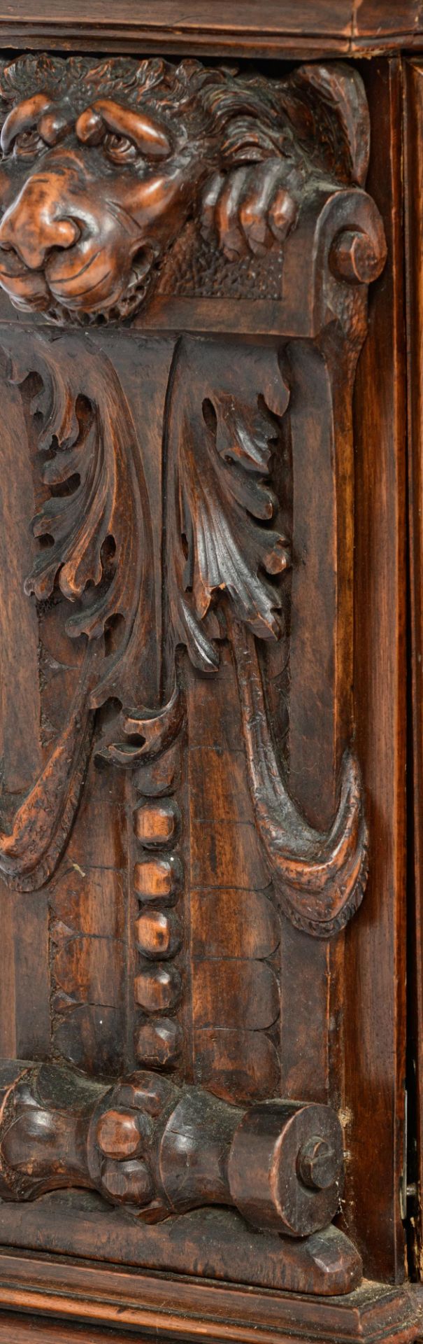 A richly sculpted walnut Renaissance style display cabinet, decorated with scrollwork, lion heads an - Image 11 of 12