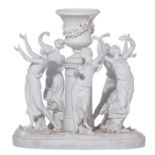 A fine biscuit centrepiece of five beauties dancing around a Medici vase, decorated with garlands, m