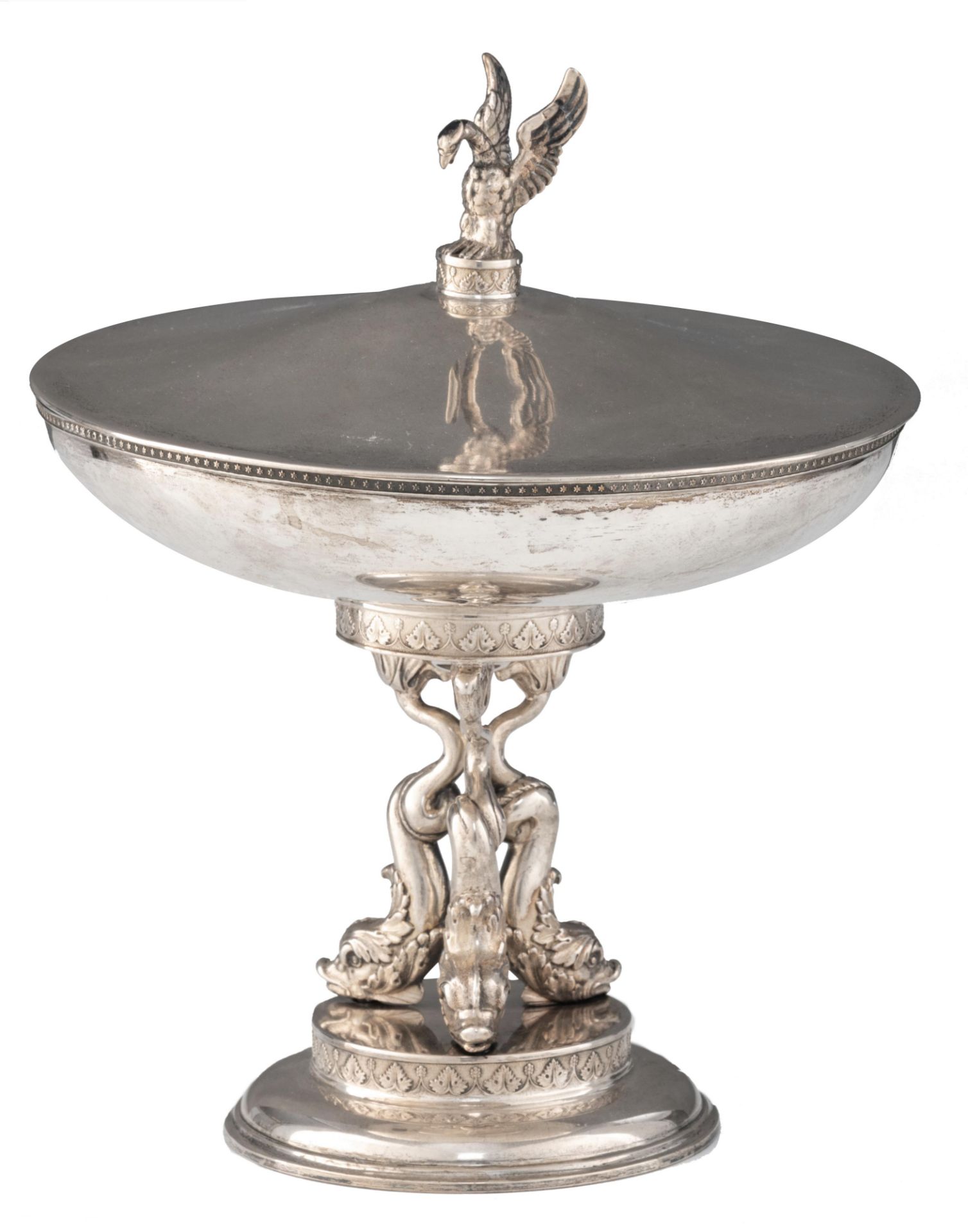 A Neoclassical silver covered tazza, the foot supported by dolphins, with vermeil to the inside, ded