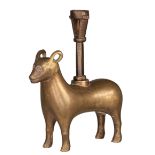 A medieval bronze zoomorphic candleholder, shaped like a goat, with on top a Gothic candlestick, pro