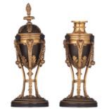 A pair of ormolu and patinated bronze Louis XVI period cassolettes candlesticks, decorated with goat