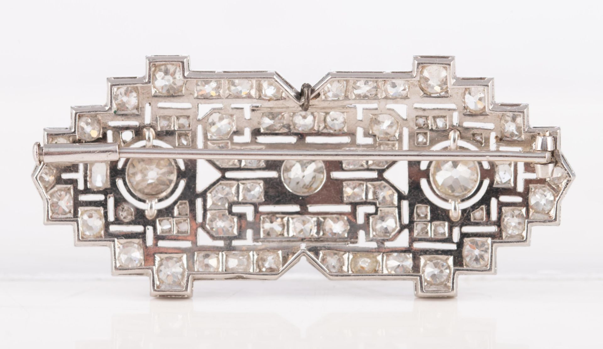 An 18ct white gold Art Deco style brooch set central with three bigger brilliant-cut diamonds and fu - Image 2 of 4