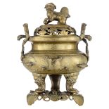 A Chinese bronze censer on matching bronze base, decorated with symbolic animals like a tortoise, a