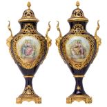 A pair of covered bleu royale ground SŠvres vases with gilt bronze mounts, the roundels polychrome d