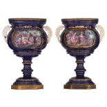 A pair of bleu royale ground SŠvres vases with brass mounts, the roundels polychrome decorated with